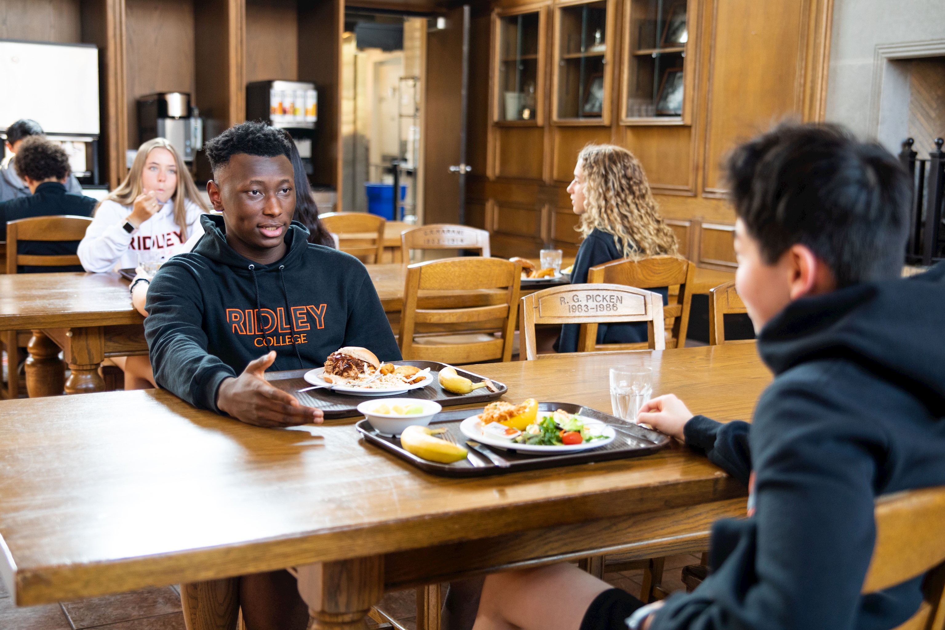 Two students chatting over lunch