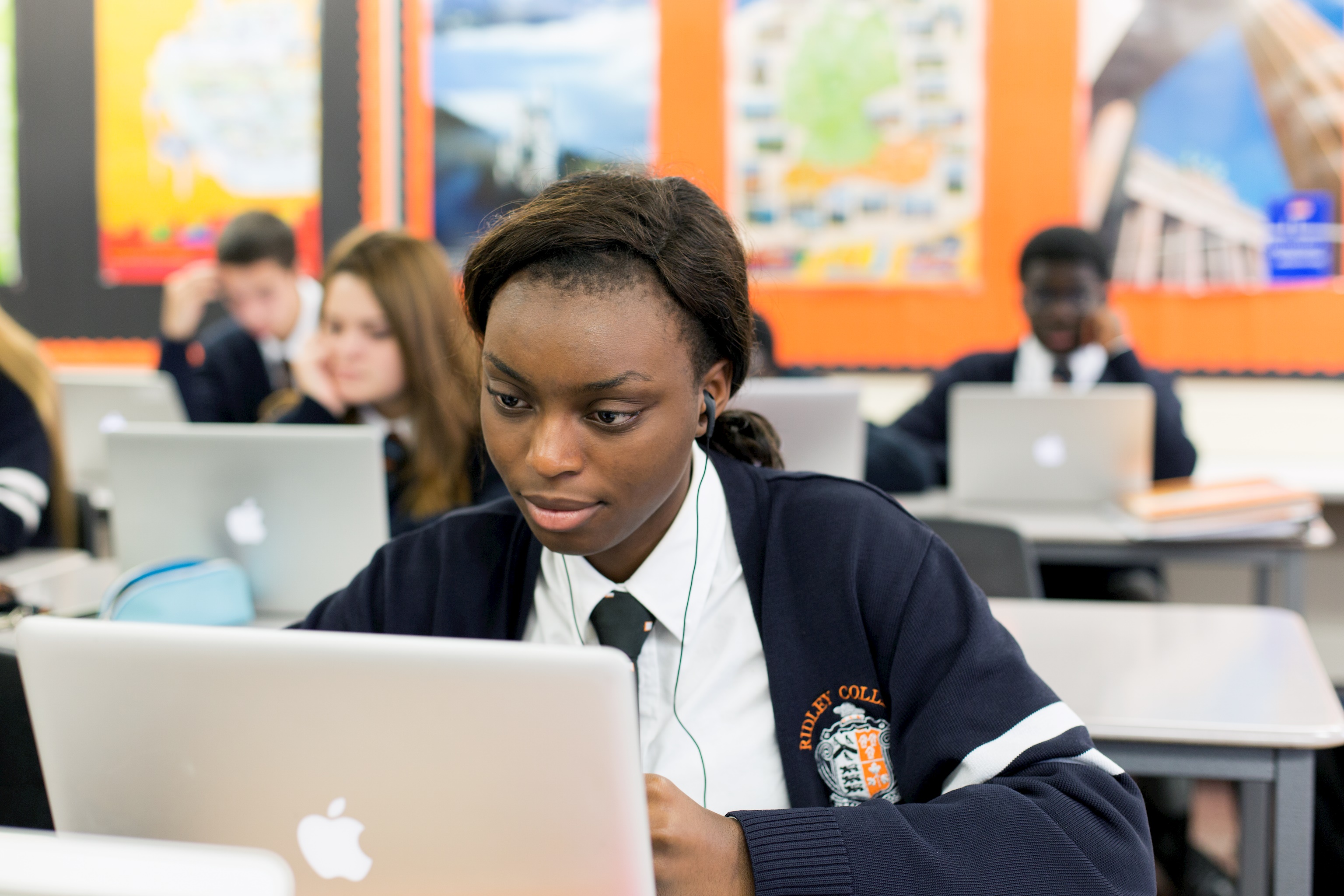 Photo of upper school student wokring on a laptop